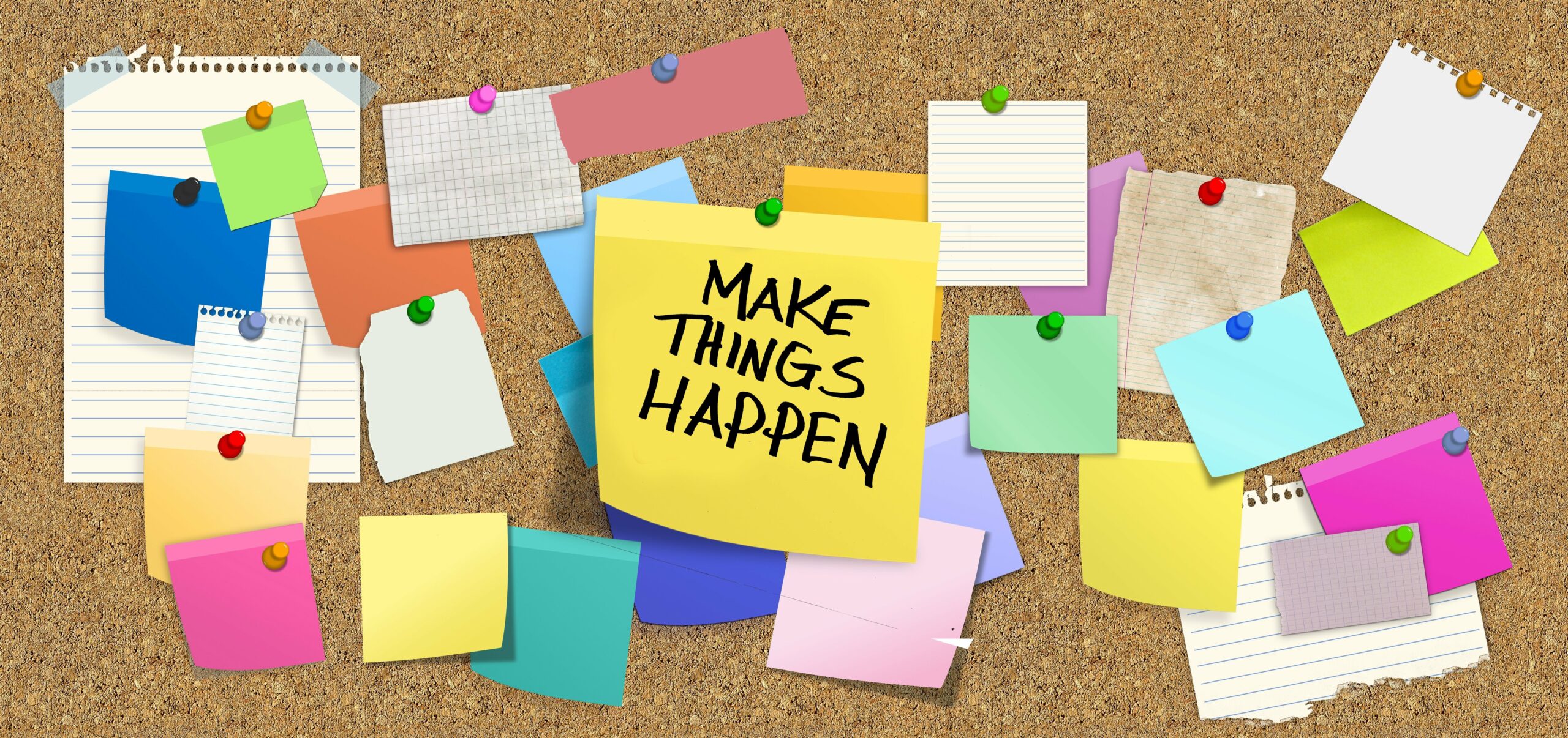 A bulletin board full of post its with one post it that says make things happen